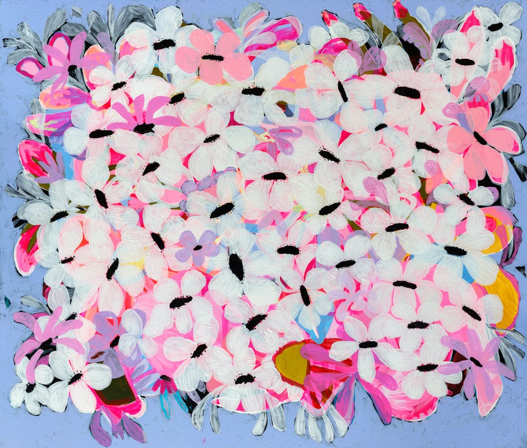 Colorful bouquet of artificial flowers with pink, white, and multicolor petals on a blue background
